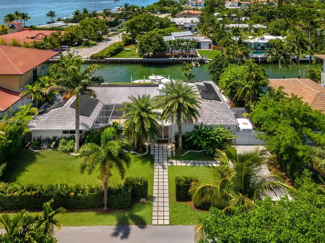 an aerial view of a house with a lake view