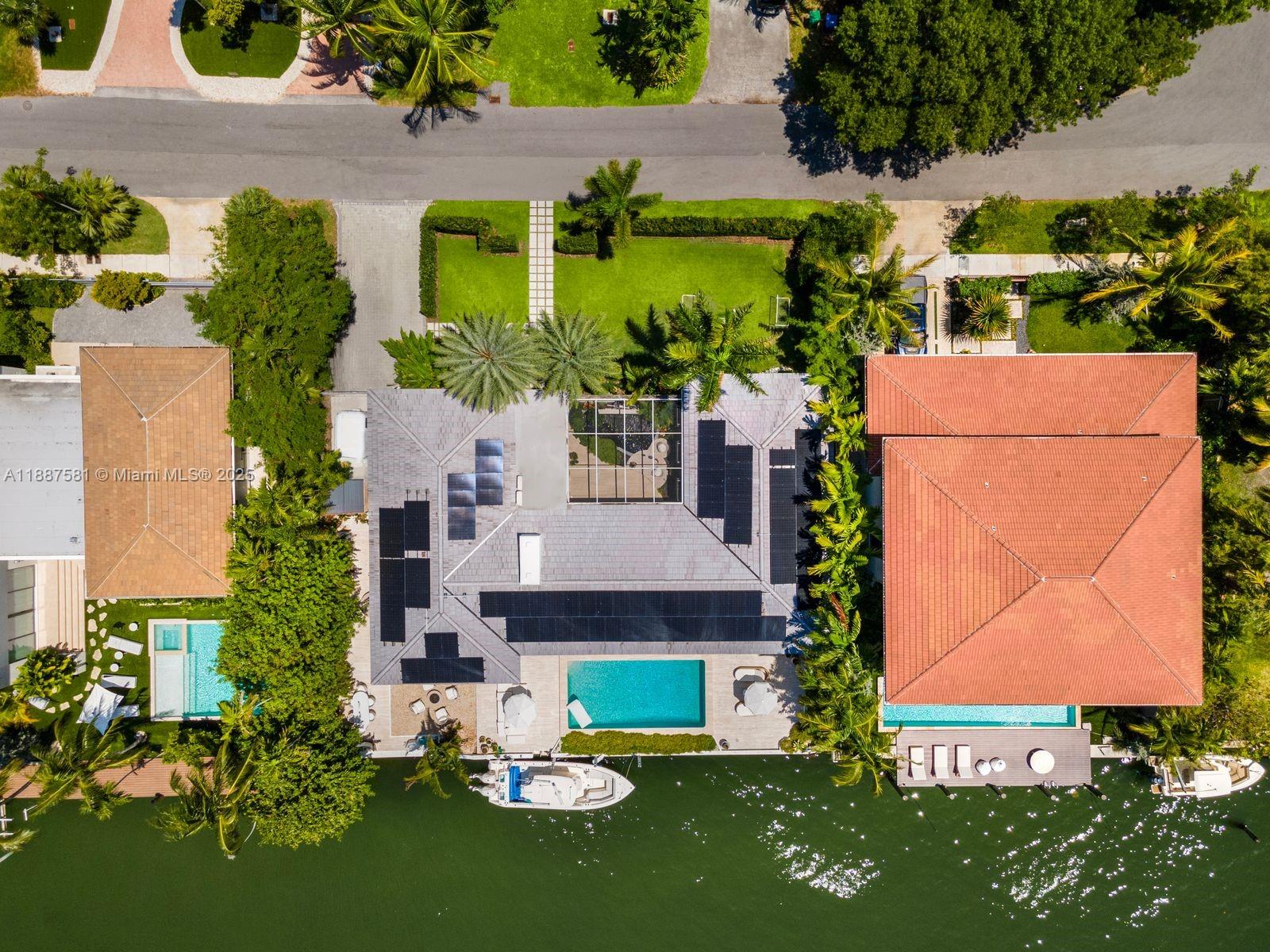 1250 Northeast 87th Street Miami, FL 33138 - Photo 50 of 53 an aerial view of a house with swimming pool a yard and outdoor seating
