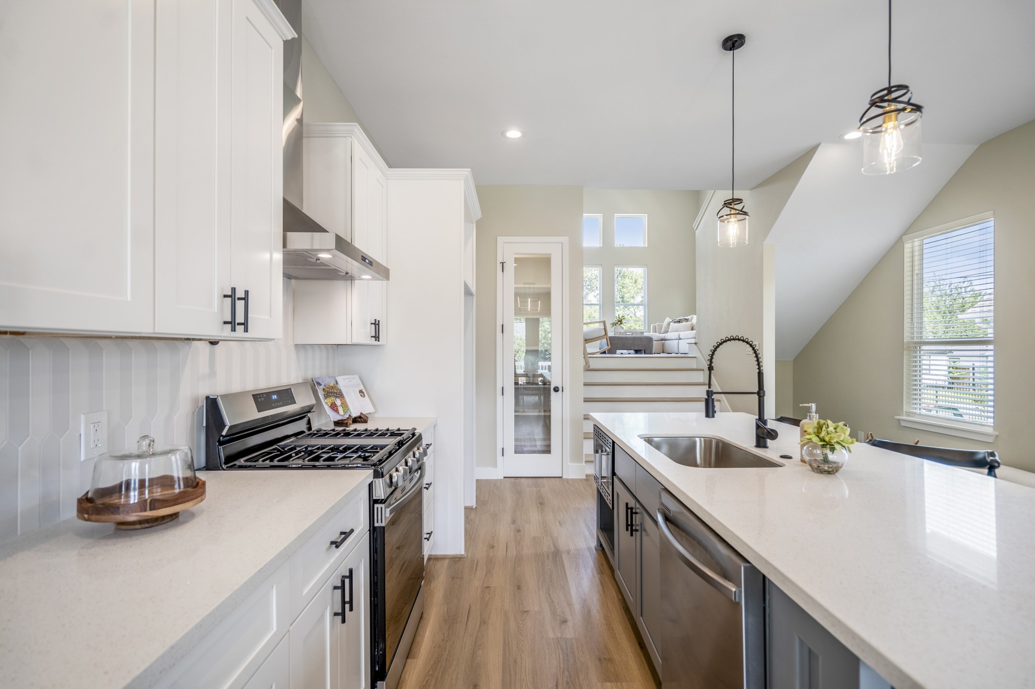 4101 East Rogers Street Houston, TX 77022 - Photo 12 of 42 a kitchen with stainless steel appliances a sink stove and cabinets