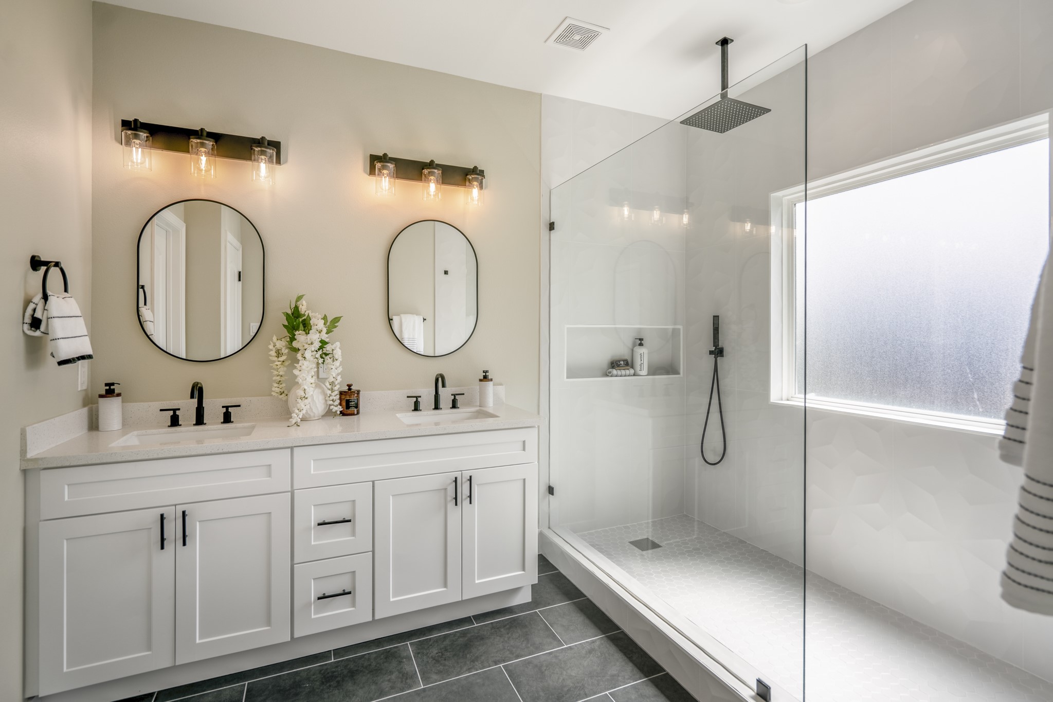 4101 East Rogers Street Houston, TX 77022 - Photo 30 of 42 a bathroom with a double vanity sink mirror and toilet