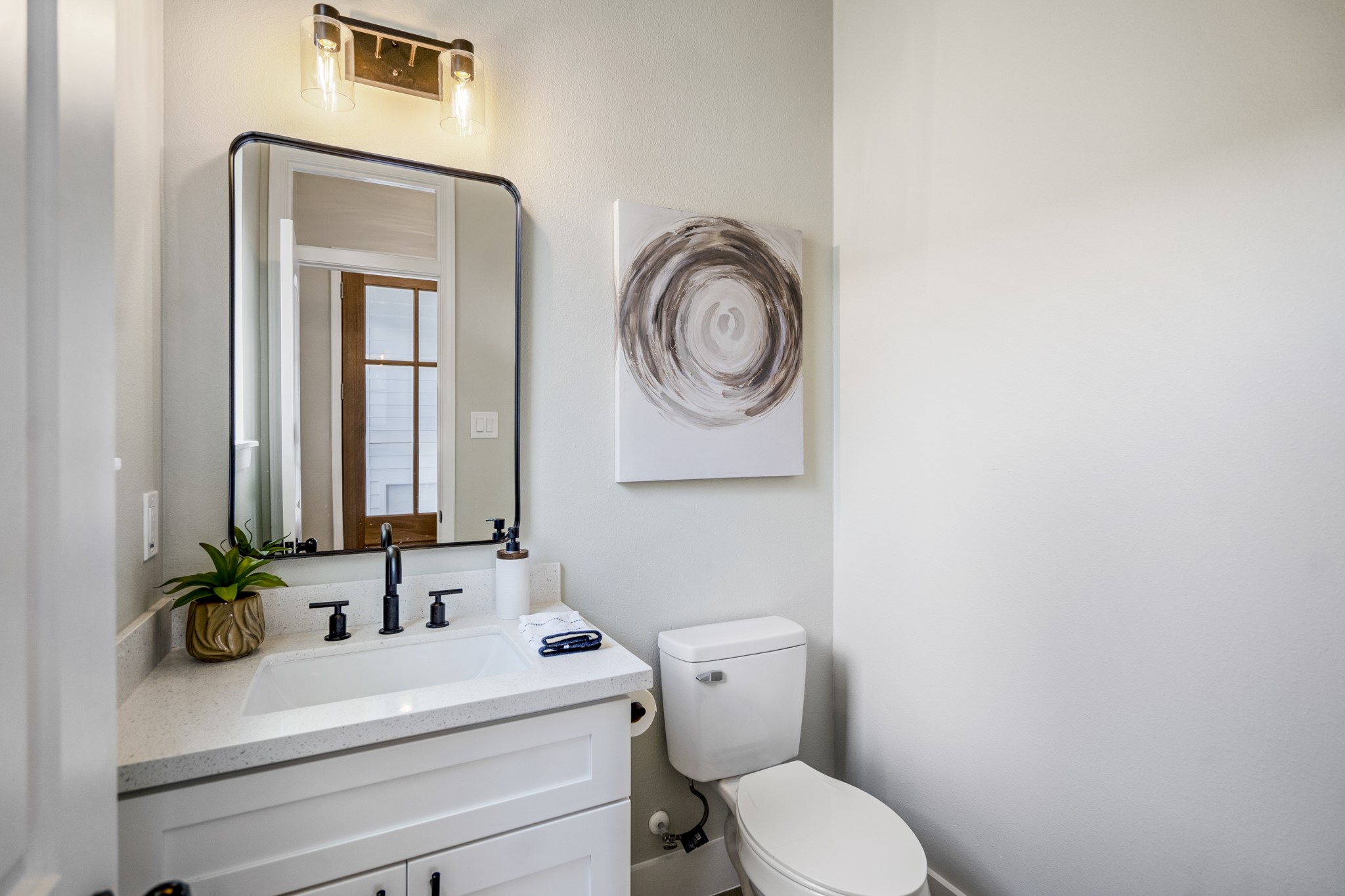 4101 East Rogers Street Houston, TX 77022 - Photo 6 of 42 a bathroom with a toilet sink and mirror