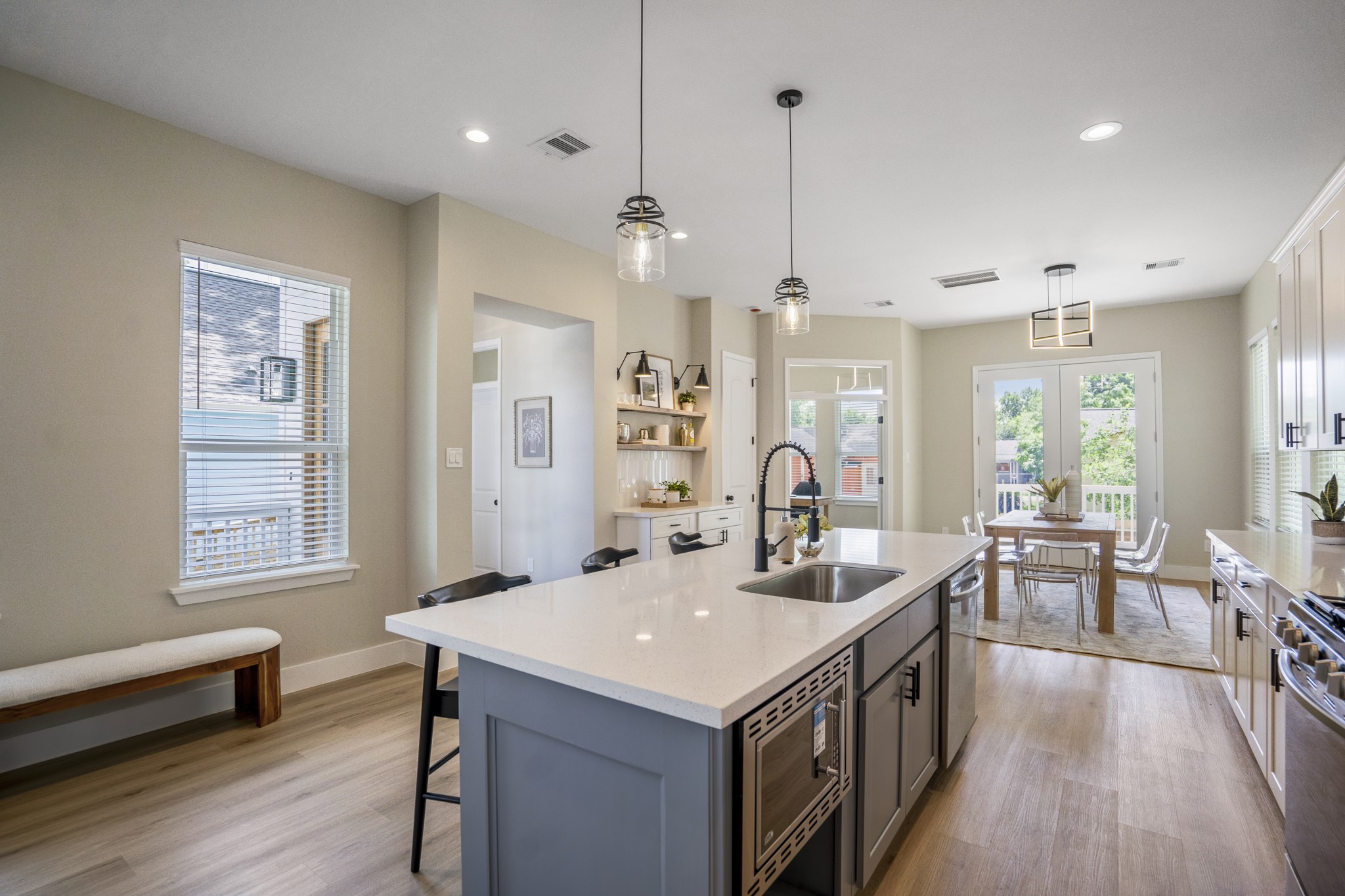 4101 East Rogers Street Houston, TX 77022 - Photo 8 of 42 a kitchen with a stove a sink a dining table and chairs