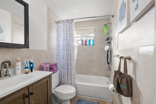 a bed room with furniture a couch and a window