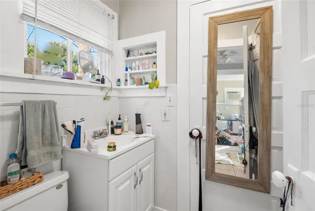 a utility room with cabinets dryer and bicycles