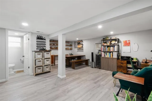 a bathroom with a sink toilet a mirror and tub