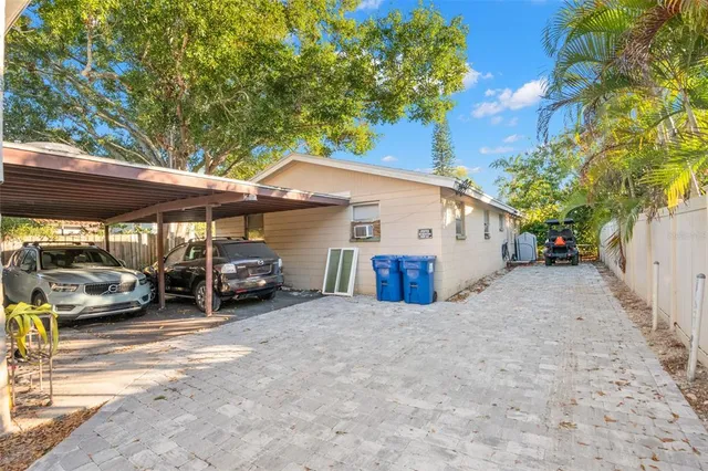 a view of a car park in front of house