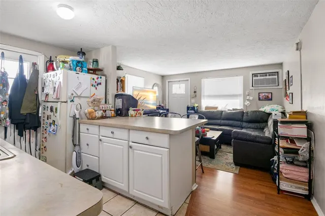 a living room with furniture a rug and a window