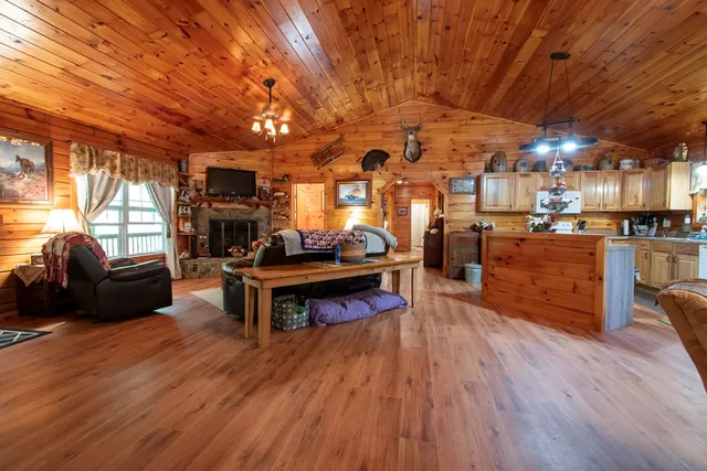 a bathroom with a toilet and a shower curtain