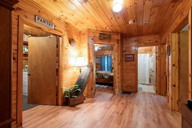 a view of hallway with wooden floor