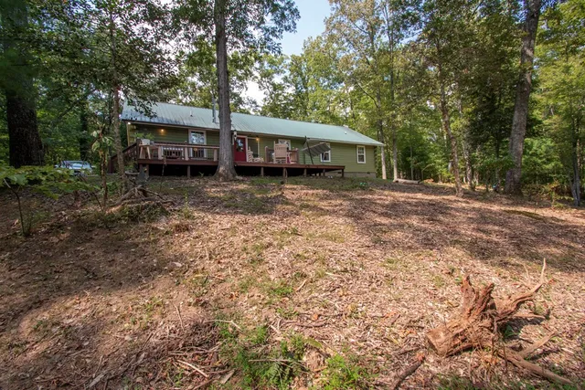 a big yard with lots of green space and trees