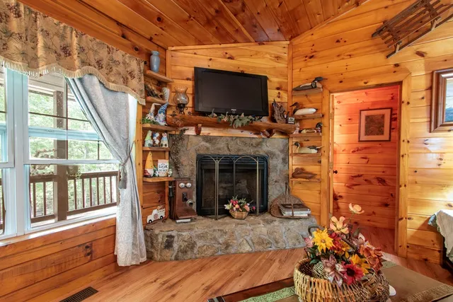 a view of a porch with furniture and a flat screen tv