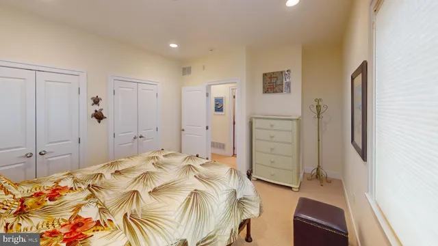 a bathroom with a granite countertop toilet and a sink