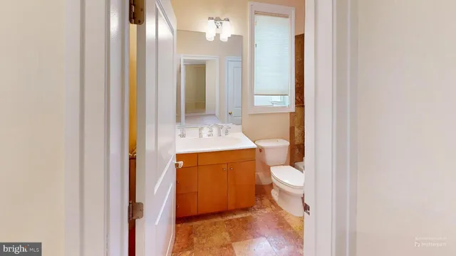 a view of a hallway with windows