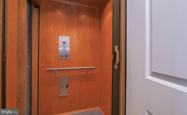 a view of a hallway with a wooden floor