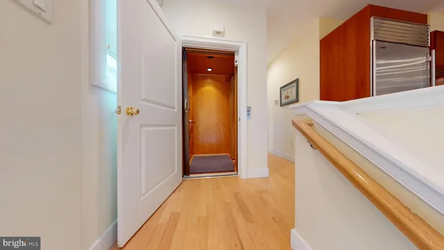 a kitchen with granite countertop a stove and a refrigerator
