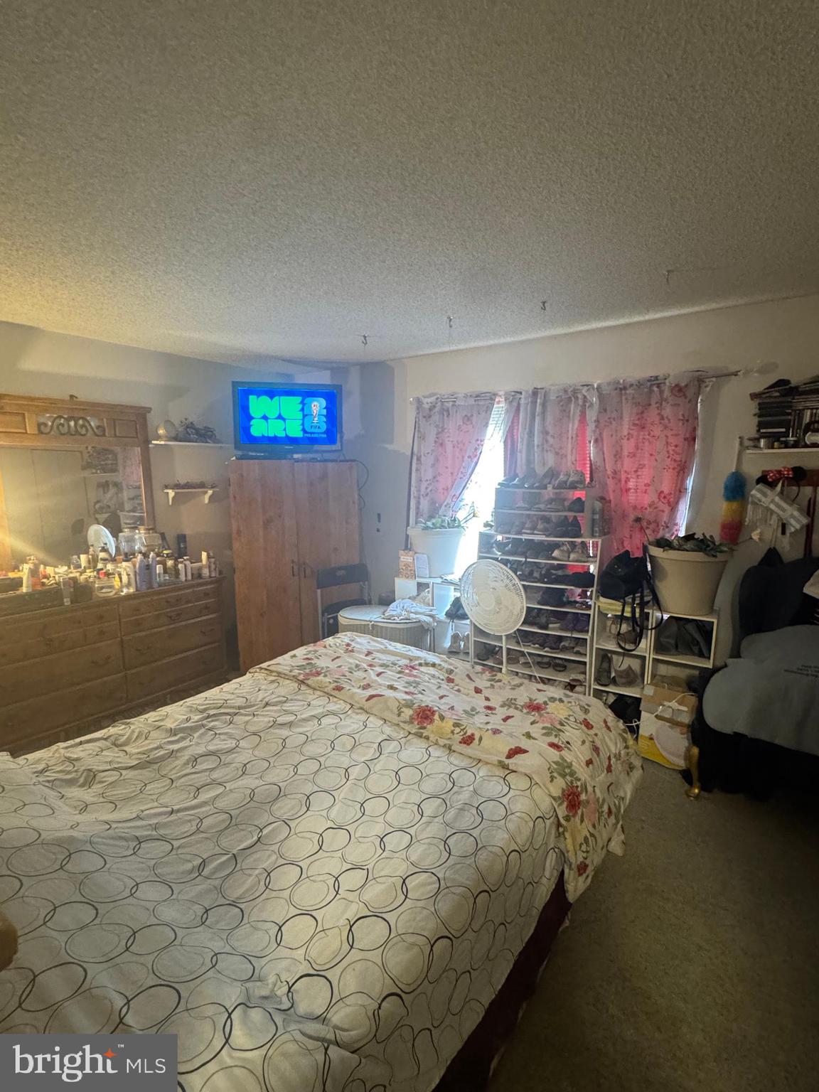 172 Mattix Run Absecon, NJ 08205 - Photo 8 of 9 a bed sitting in a bedroom and chair next to a window
