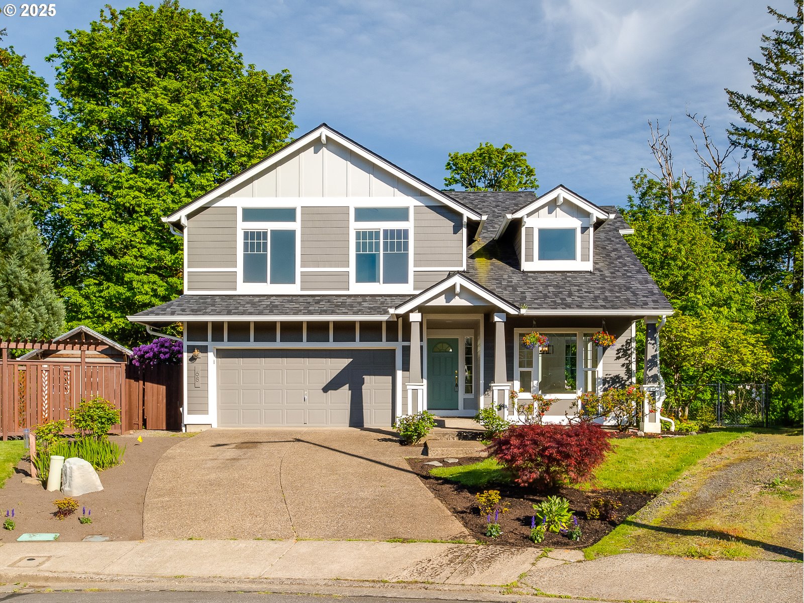 68 Southeast 47th Circle Gresham, OR 97080 - Photo 1 of 30 a front view of a house with a yard and garage