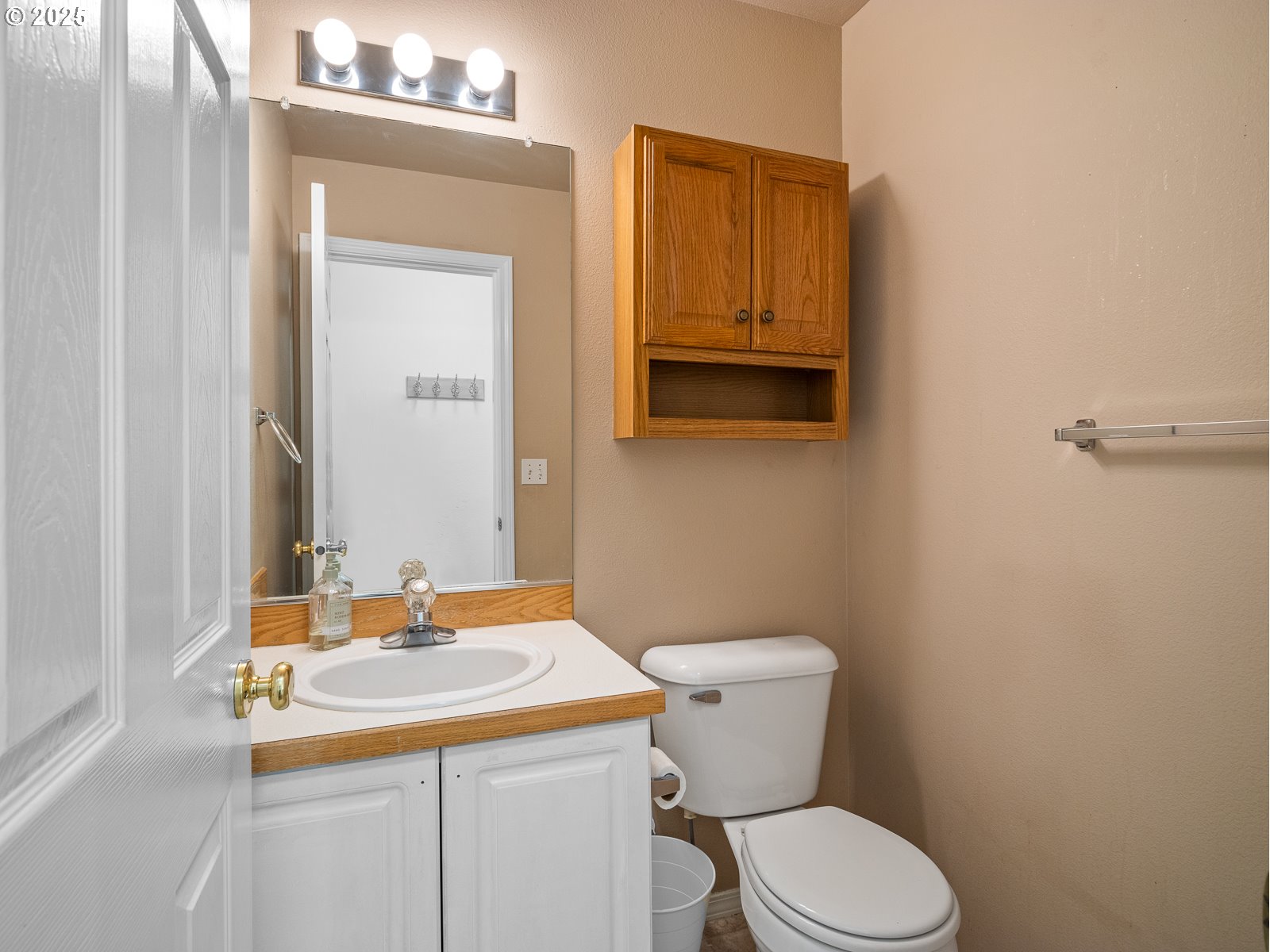 68 Southeast 47th Circle Gresham, OR 97080 - Photo 12 of 30 a bathroom with a sink a toilet and mirror