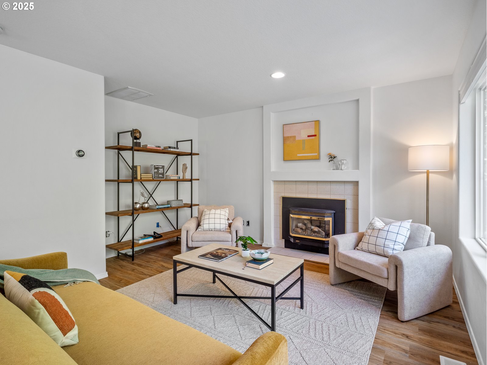 68 Southeast 47th Circle Gresham, OR 97080 - Photo 4 of 30 a living room with furniture and a fireplace