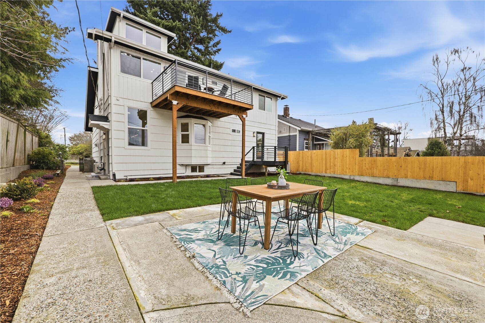 9011 36th Avenue Southwest Seattle, WA 98126 - Photo 36 of 40 a view of a chair and table in backyard of the house