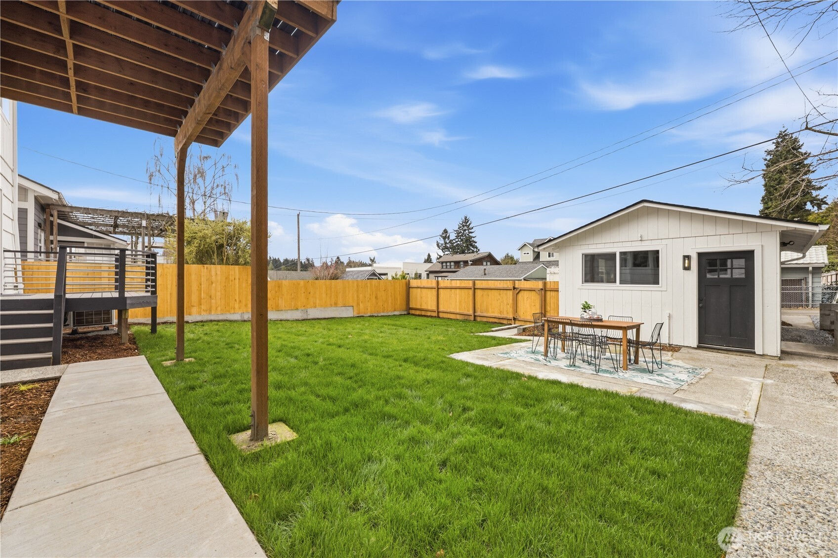 9011 36th Avenue Southwest Seattle, WA 98126 - Photo 39 of 40 a view of a backyard with sitting area