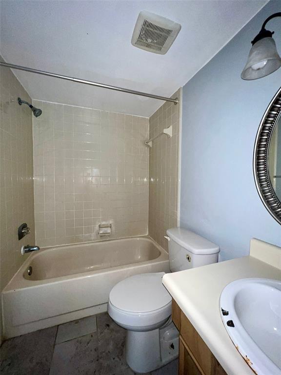 3964 Dream Oak Place, Unit 104 Tampa, FL 33613 - Photo 11 of 11 a bathroom with a sink a toilet and a bathtub