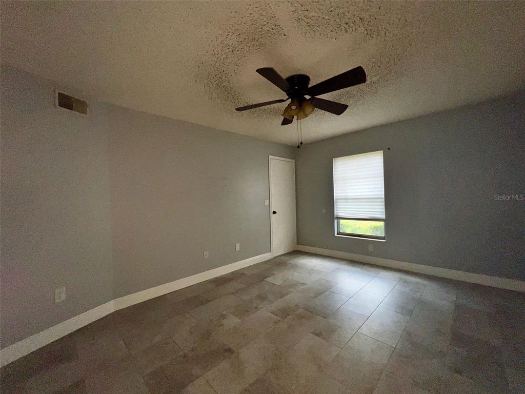 3964 Dream Oak Place, Unit 104 Tampa, FL 33613 - Photo 6 of 11 a view of an empty room and window
