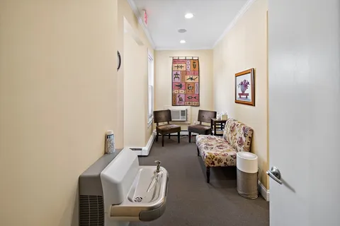 a bedroom with furniture and a window