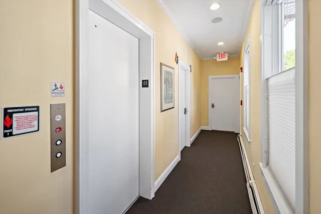 a view of a hallway with a dining area
