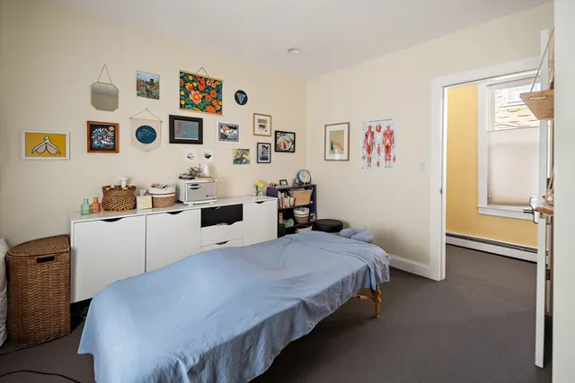 a bedroom with a bed and cabinets