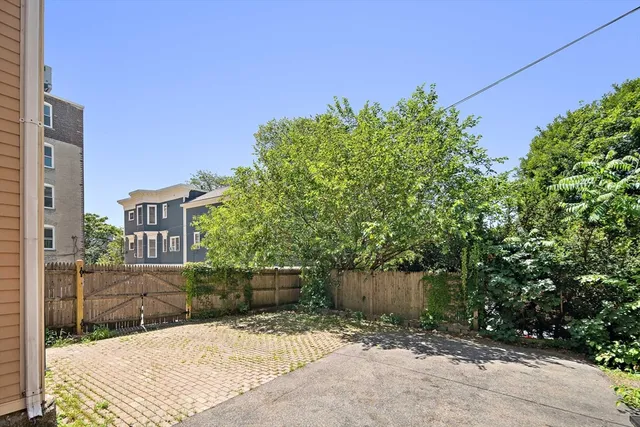 a backyard of a house with lots of green space