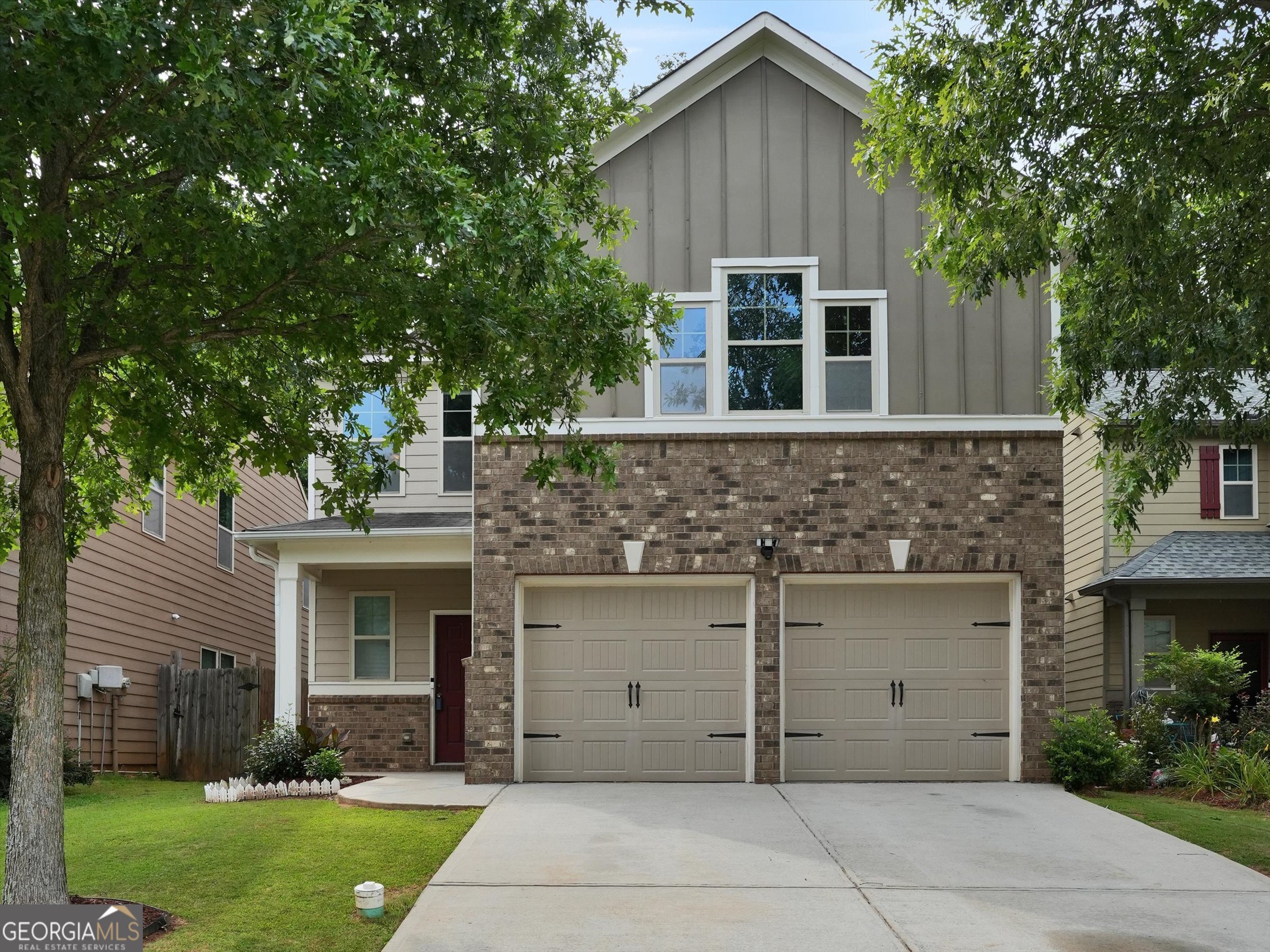 5087 Jack Drive, Unit 80 Decatur, GA 30035 - Photo 1 of 1 a view of a house with a garden