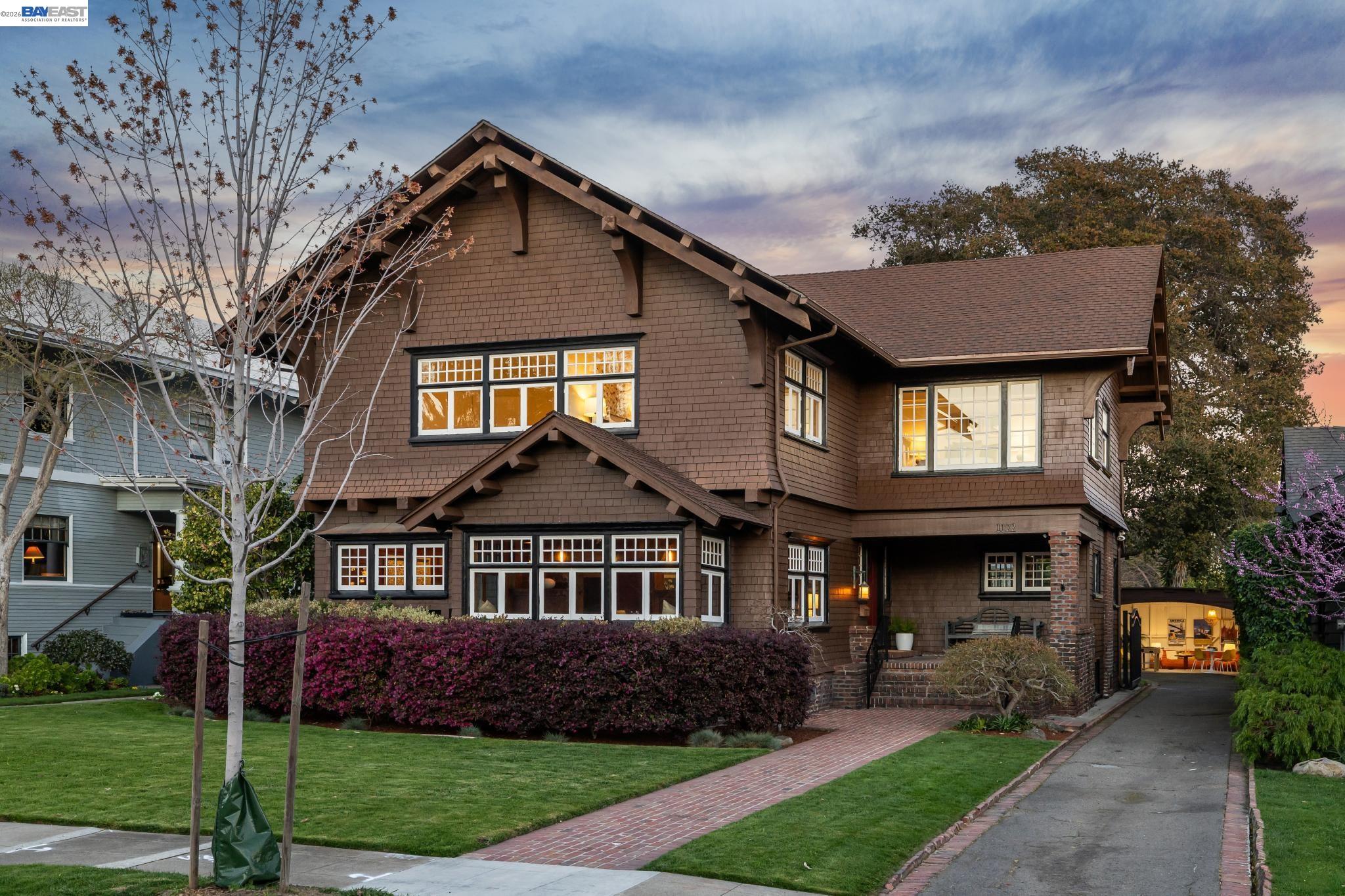 1122 Bay Street Alameda, CA 94501 - Photo 1 of 60 a front view of a house with a garden and trees