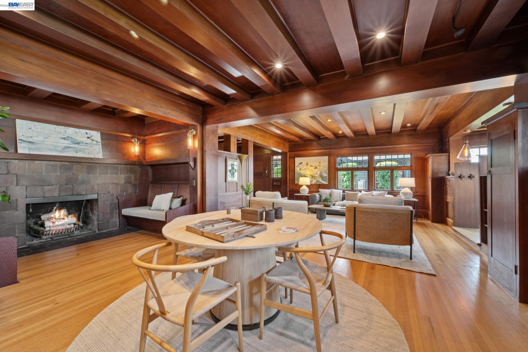 1122 Bay Street Alameda, CA 94501 - Photo 17 of 60 a dining room with furniture a fireplace and wooden floor