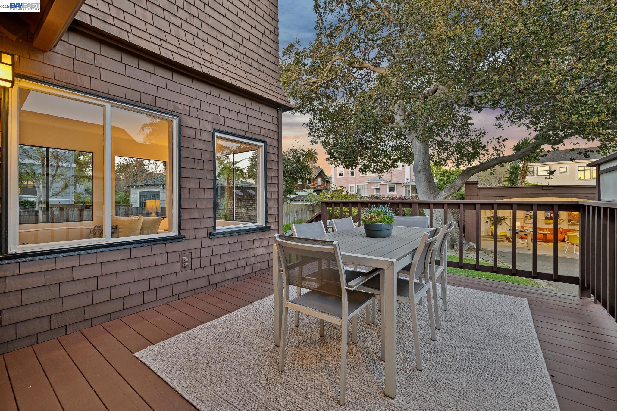 1122 Bay Street Alameda, CA 94501 - Photo 25 of 60 a view of a patio with table and chairs and wooden floor