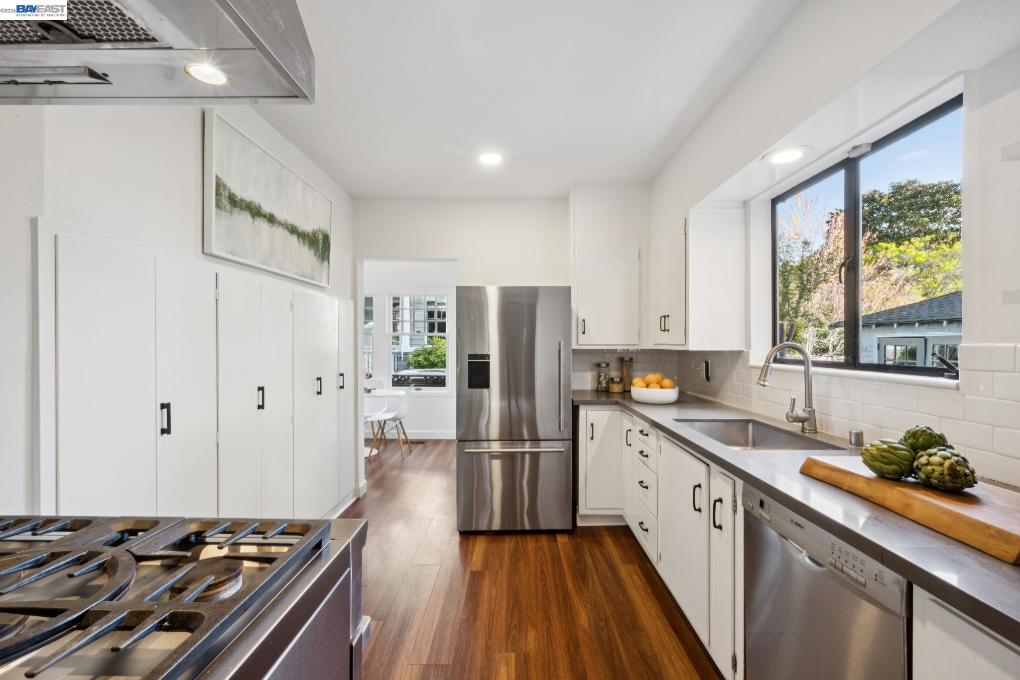 1122 Bay Street Alameda, CA 94501 - Photo 29 of 60 a kitchen with a sink stove and refrigerator