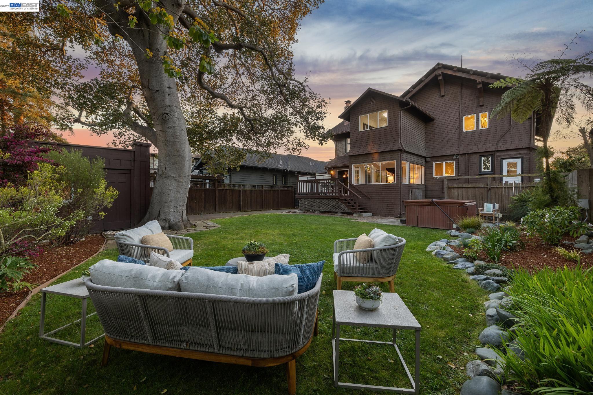 1122 Bay Street Alameda, CA 94501 - Photo 3 of 60 a view of a white house with a yard floor and a fire pit