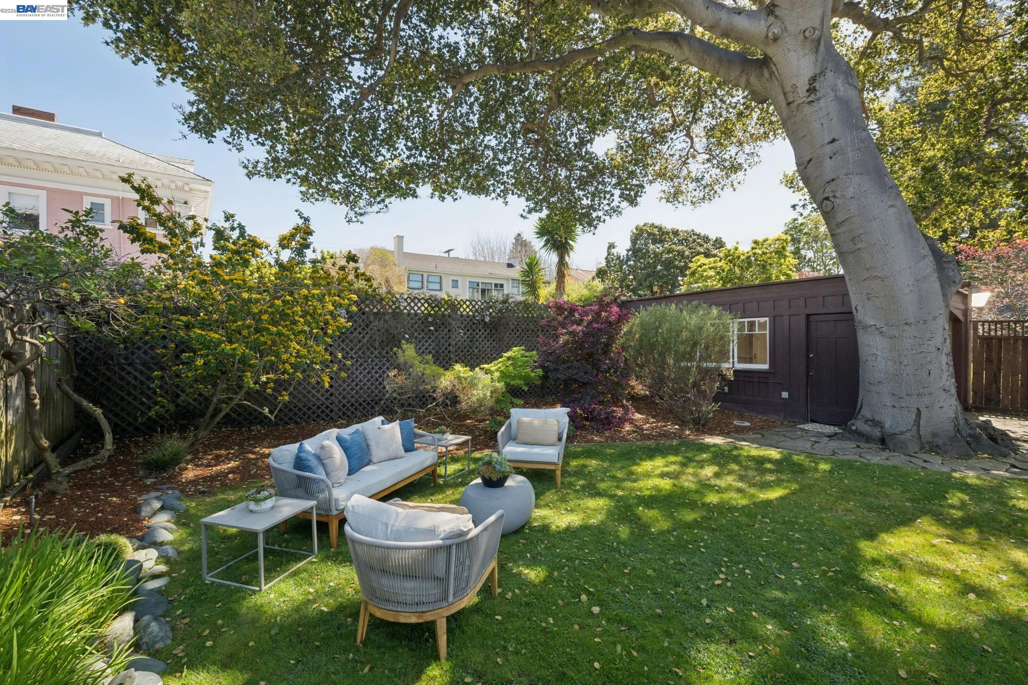 1122 Bay Street Alameda, CA 94501 - Photo 34 of 60 a view of a chair and table in backyard of the house