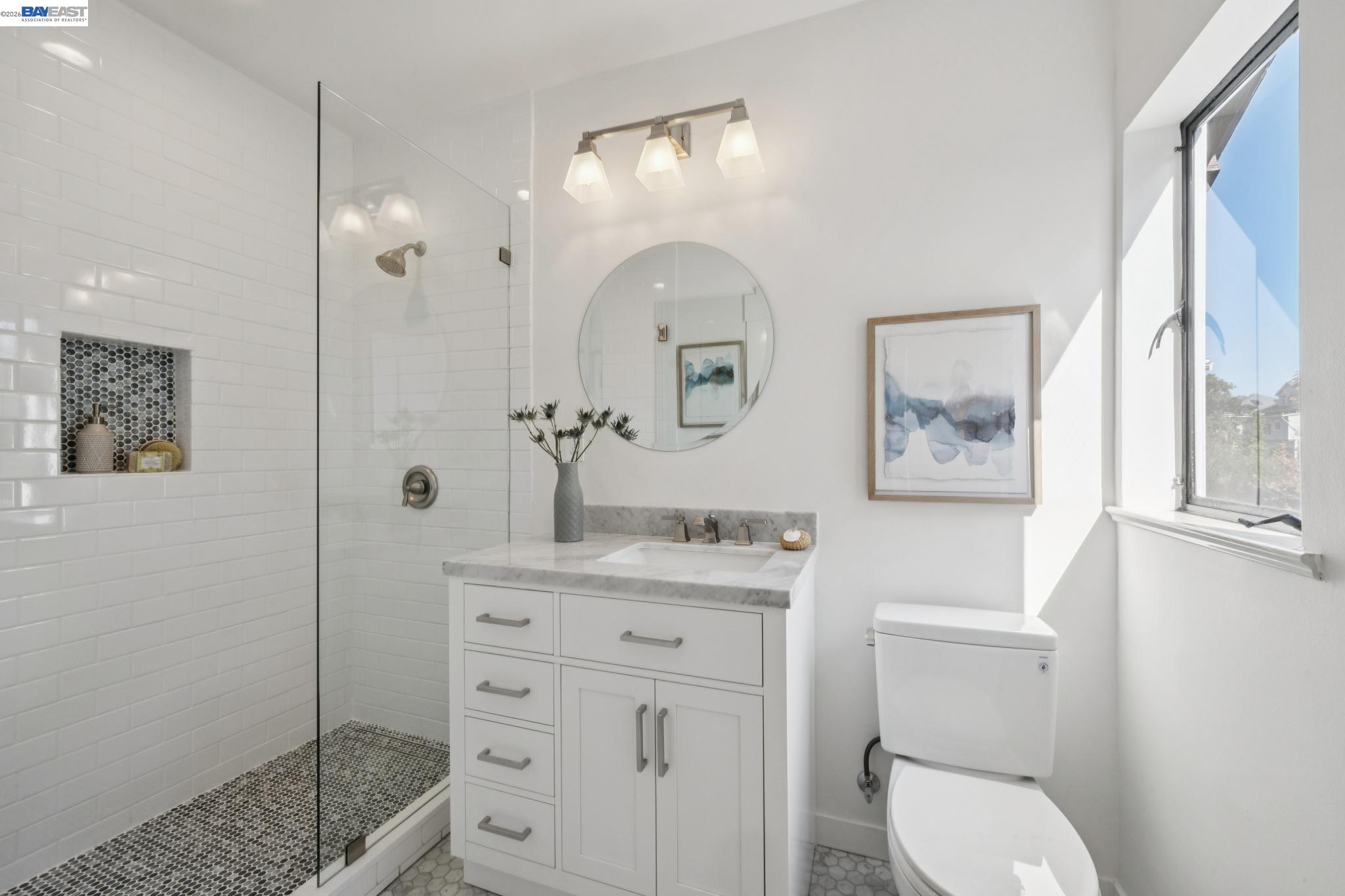 1122 Bay Street Alameda, CA 94501 - Photo 42 of 60 a bathroom with a toilet a sink and mirror