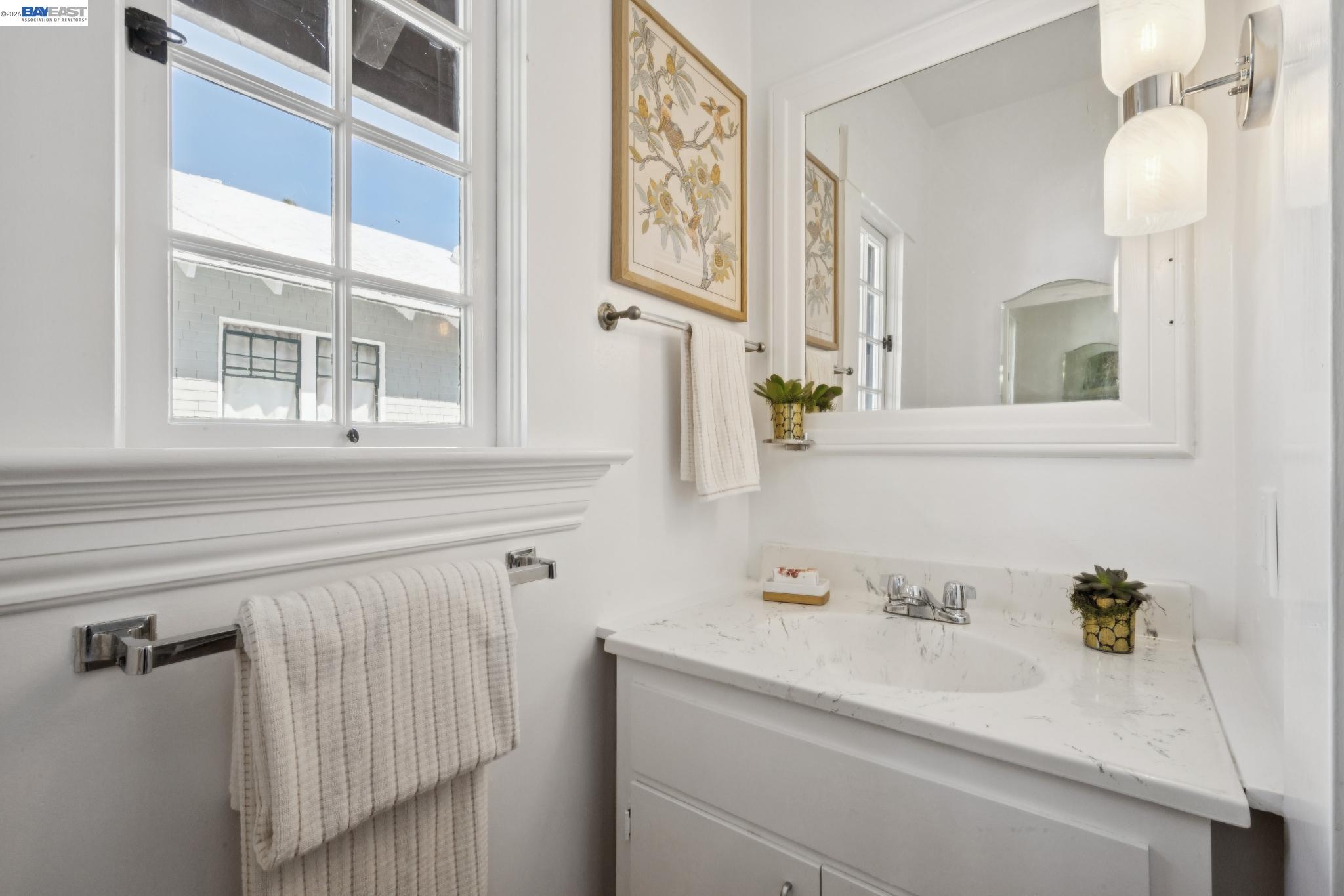 1122 Bay Street Alameda, CA 94501 - Photo 49 of 60 a bathroom with a sink and a mirror