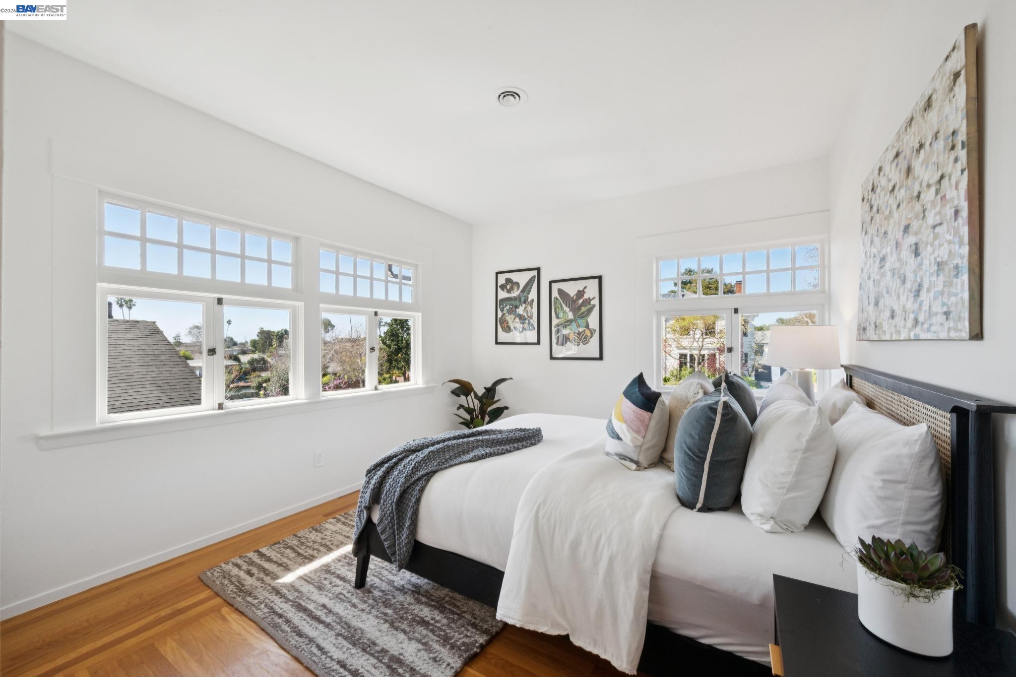 1122 Bay Street Alameda, CA 94501 - Photo 50 of 60 a bedroom with bed and wooden floor