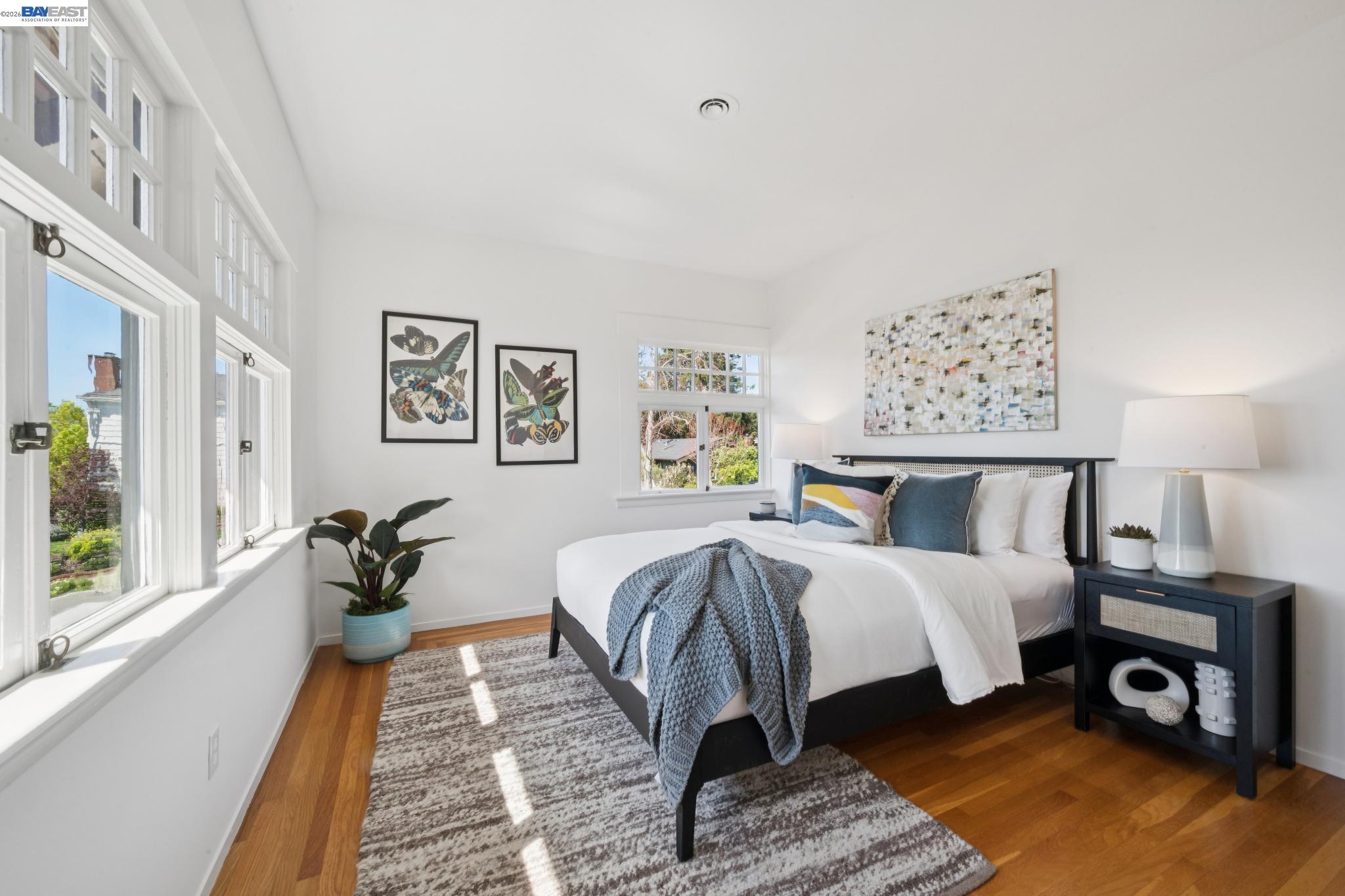 1122 Bay Street Alameda, CA 94501 - Photo 51 of 60 a bedroom with a bed and wooden floor