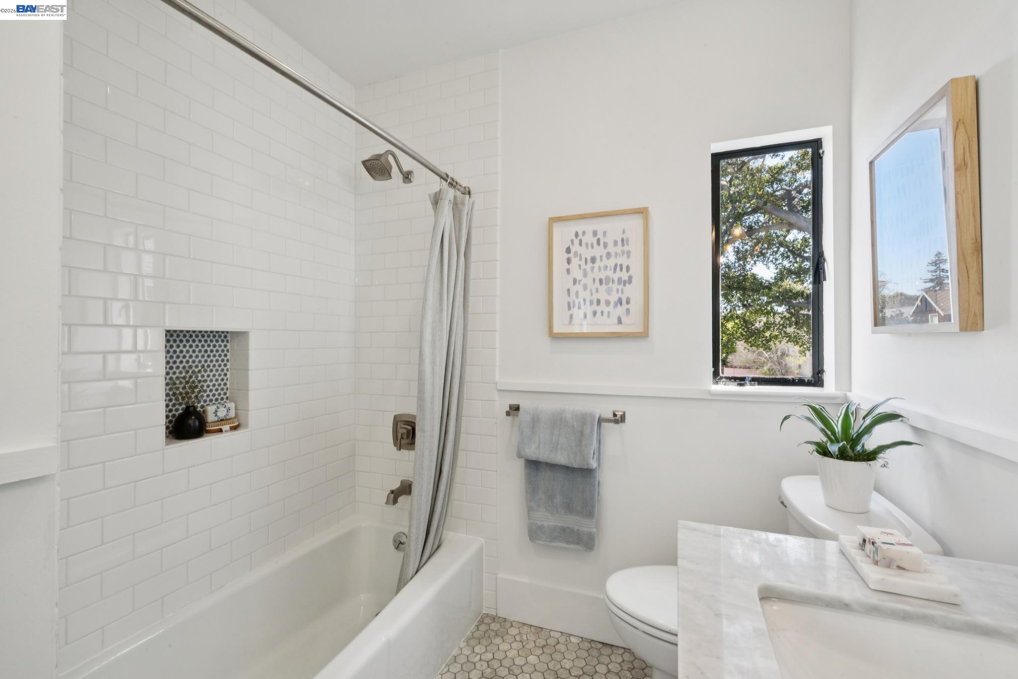 1122 Bay Street Alameda, CA 94501 - Photo 53 of 60 a bathroom with a bathtub shower sink and toilet