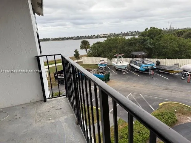 a view of a balcony with mountain view and wooden floor