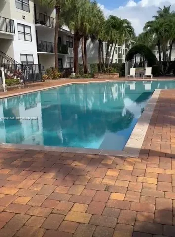 a view of a yard with plants