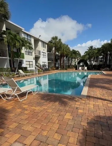 a view of a backyard with a patio