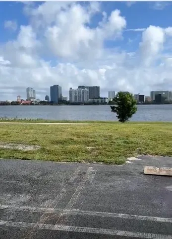 a view of a swimming pool and an outdoor seating