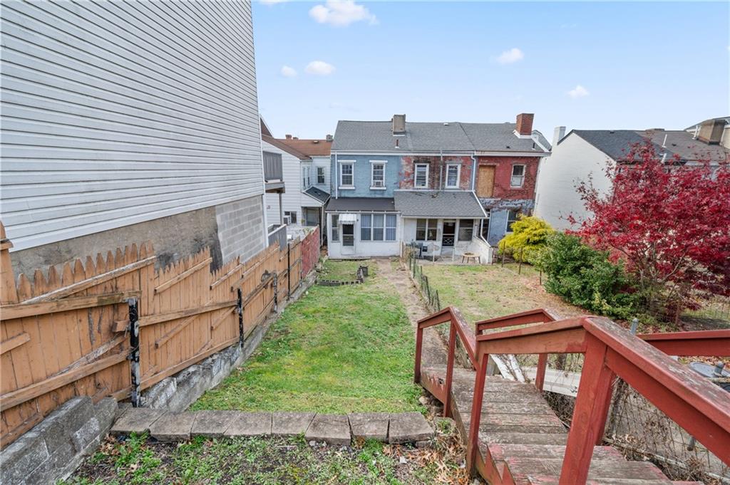 5154-5158 Natrona Way Pittsburgh, PA 15201 - Photo 19 of 46 a view of a house with backyard and sitting area
