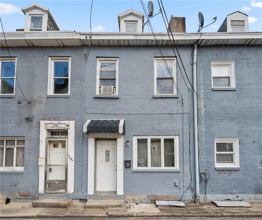 5154-5158 Natrona Way Pittsburgh, PA 15201 - Photo 20 of 46 a view of a building with many windows