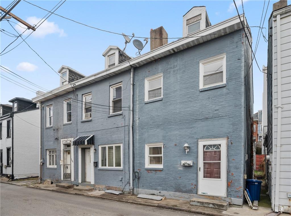 5154-5158 Natrona Way Pittsburgh, PA 15201 - Photo 2 of 46 a front view of a building with multiple windows